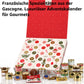 Aufgeklappter Adventskalender Périgord mit roter Deckelinnenseite, davor Dosen und Gläser; Text: Französische Spezialitäten aus der Gascogne